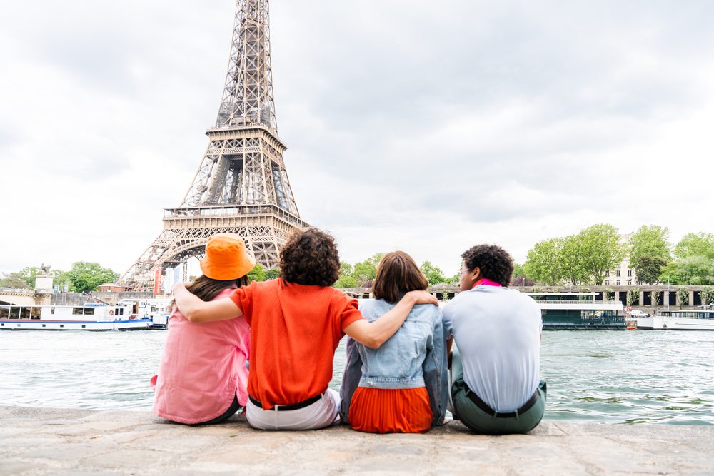 Travel with Teenagers
Young happy friends visiting Paris and Eiffel Tower, Trocadero area and Seine river - Multicultural group of tourists sightseeing the France capital city