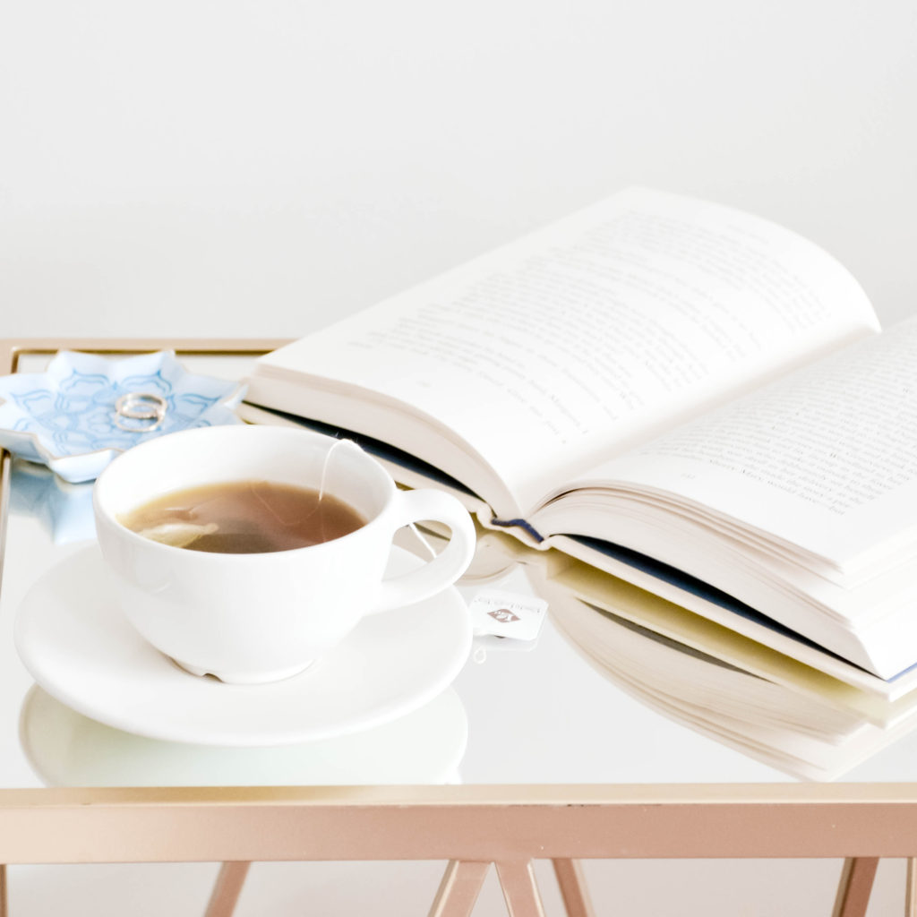 A book and a cup of hot tea.  How to stay healthy while on vacation.
