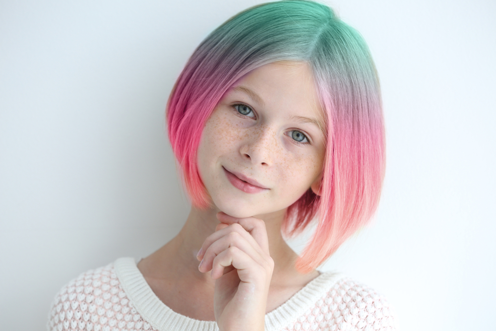 Summer Bucket List Ideas for Teens.
Trendy hairstyle concept. Girl with colorful dyed hair on white background