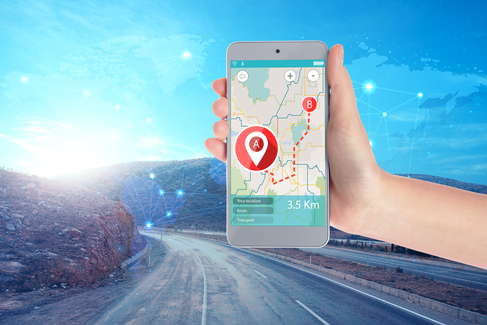 Stress-Free Travel Tips.
Travel apps concept. Woman using map application in smartphone for planning route and road on background