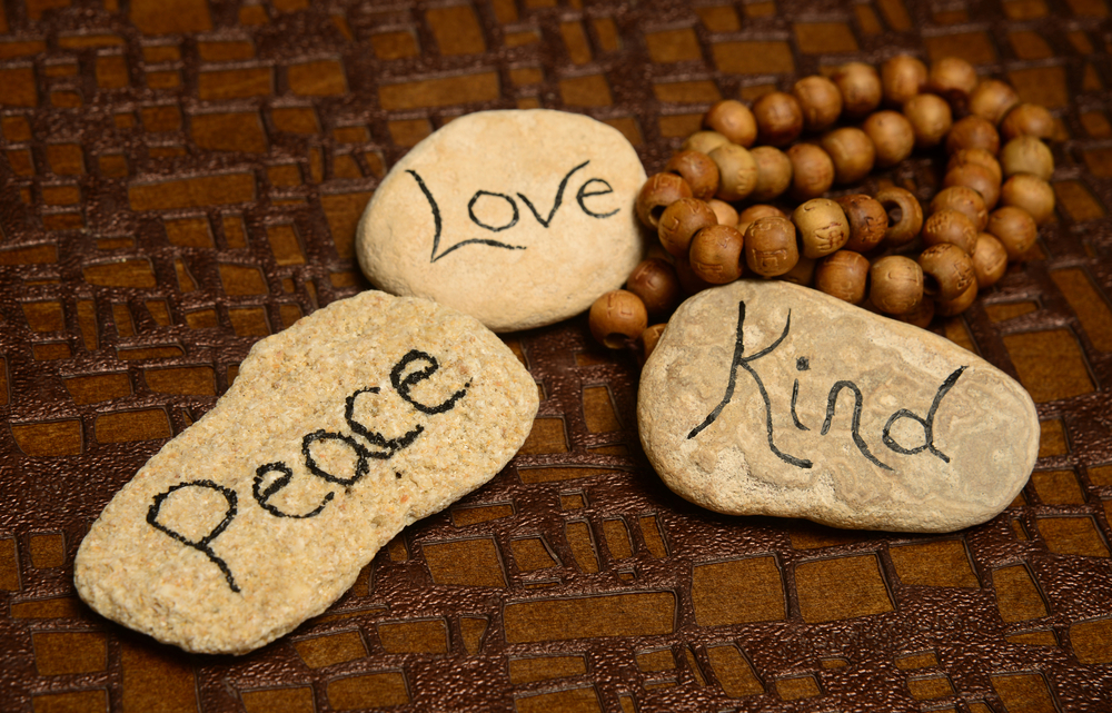Sustainable Travel Kit.
Peace, love and kindness words on rocks for world peace