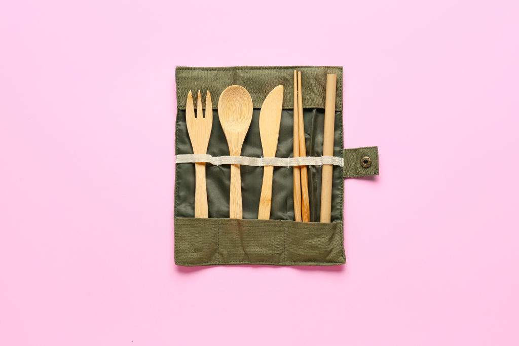 Eco-Friendly Travel Products.
Eco cutlery on color background