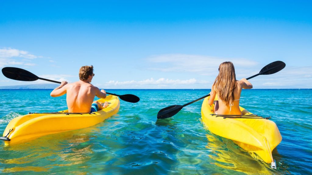 Couple kayaking.
Travel workouts