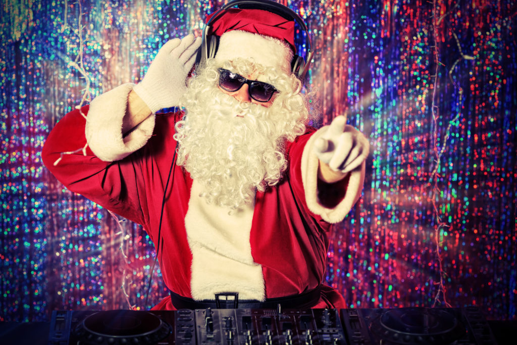 Christmas Bucket List Ideas.
DJ Santa Claus mixing up some Christmas cheer. Disco lights in the background.