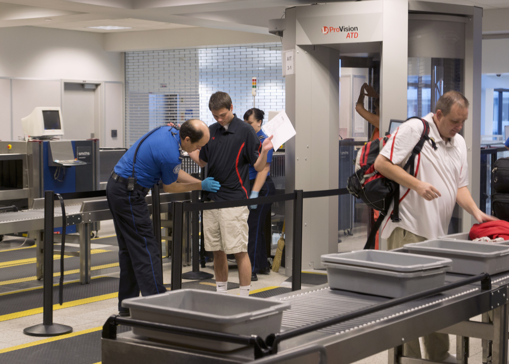Airport Etiquette
Travelers pass through the ProVision ATD Image-Free Scanner, a new technology used at security checkpoints that can automatically detect concealed objects made of any type of material.